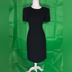 Black Donna Morgan Sz 10 dress with sheer short sleeves with beautiful beading